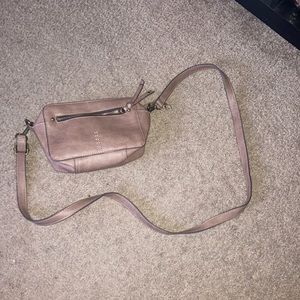 I’m selling a brown crossbody bag. It’s a small crossbody. Good for vacation.